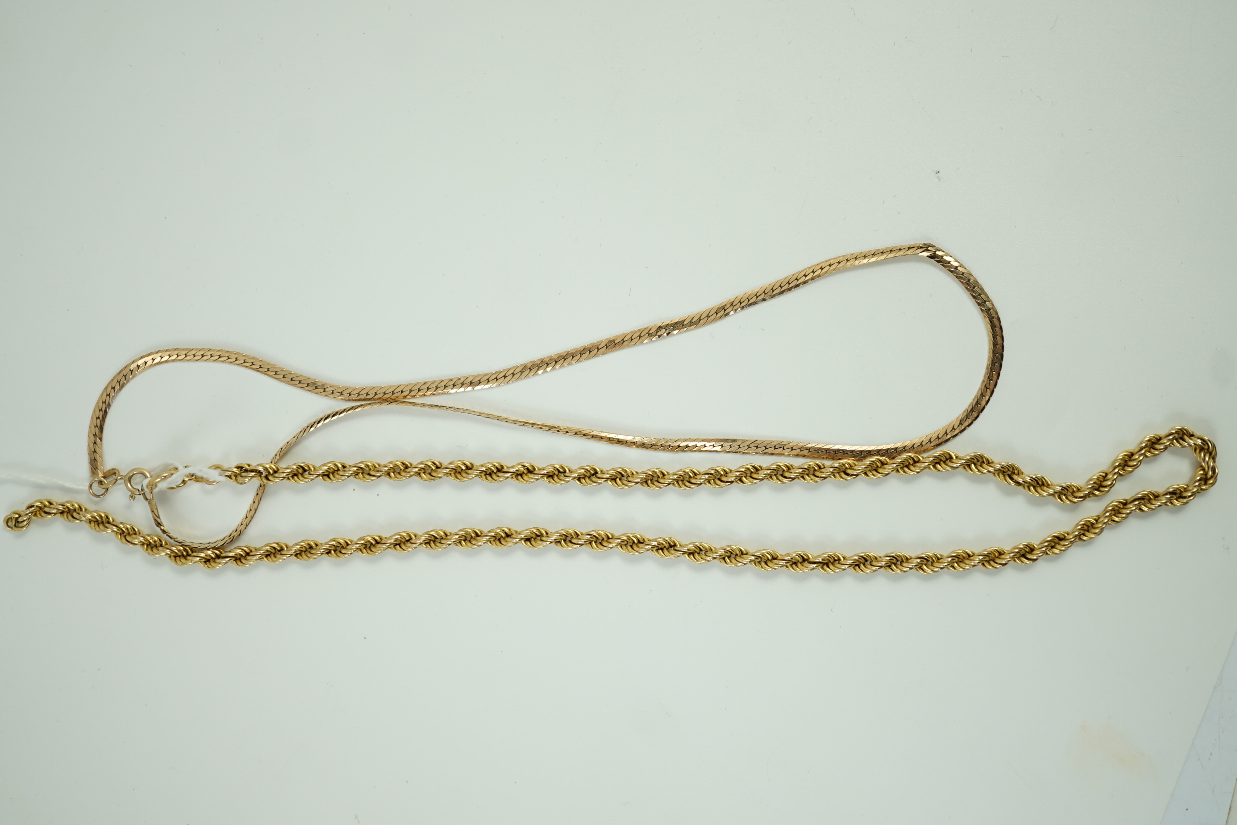 A modern 9k rope twist necklace, 50cm and a 9ct gold flat link necklace, 45cm, 18 grams.